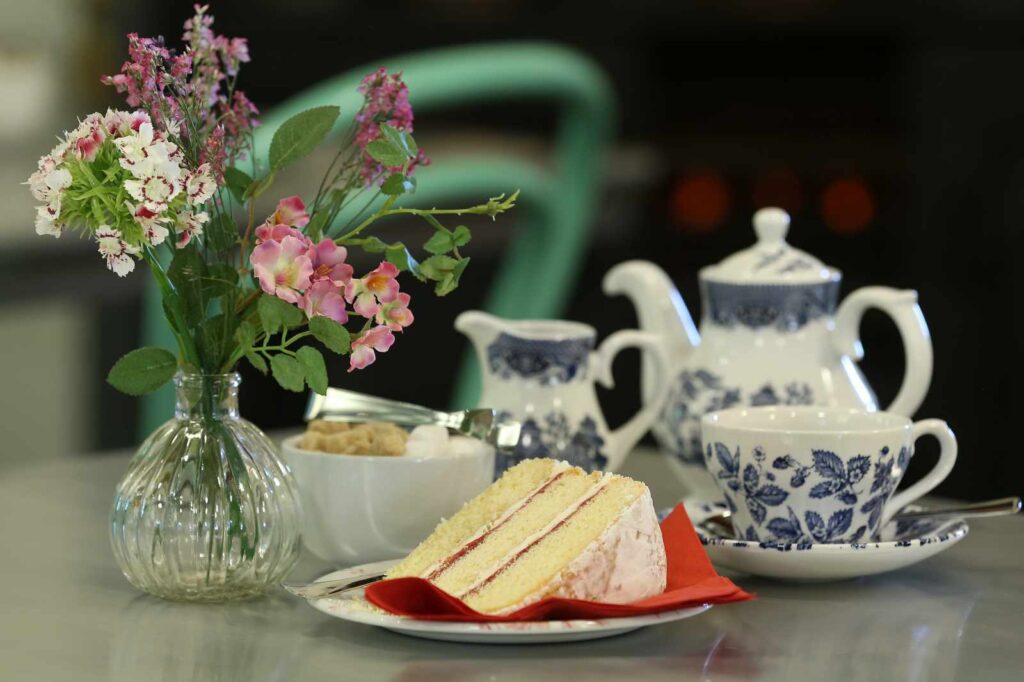 Slice of cake and tea set in the Castell Coch tea room