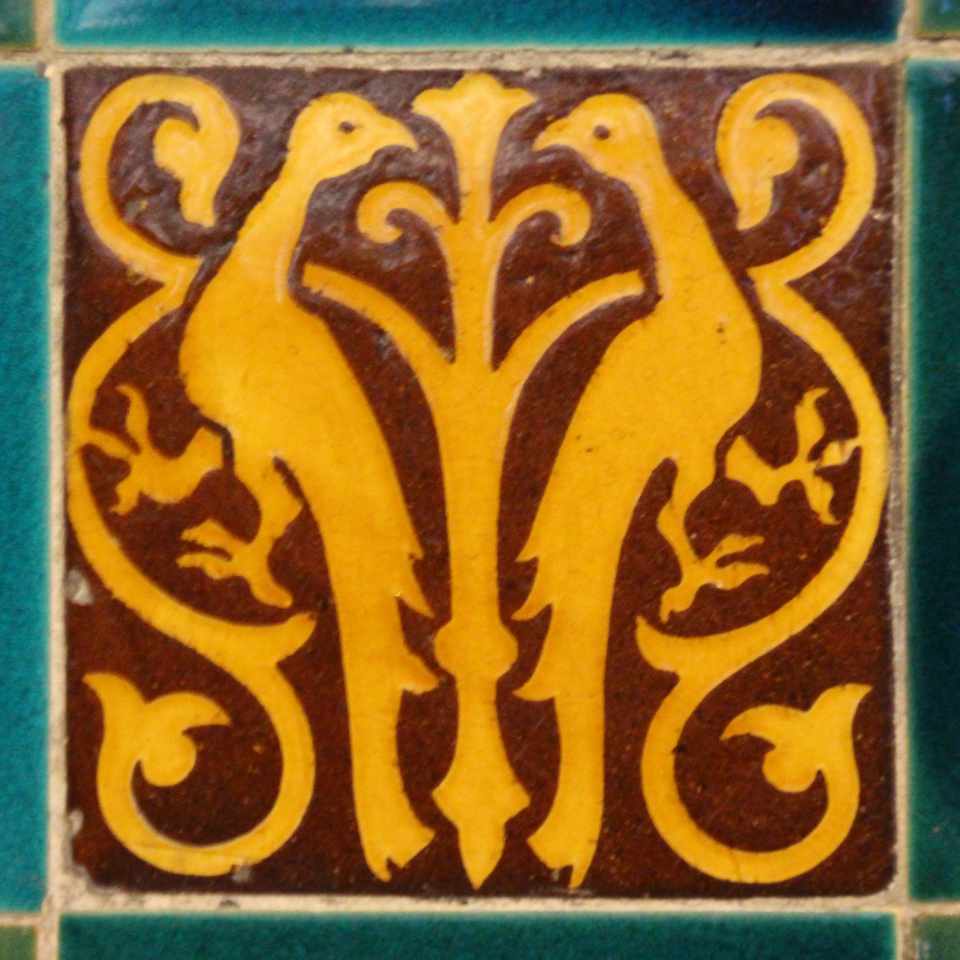 A tile from Castell Coch with a bird design